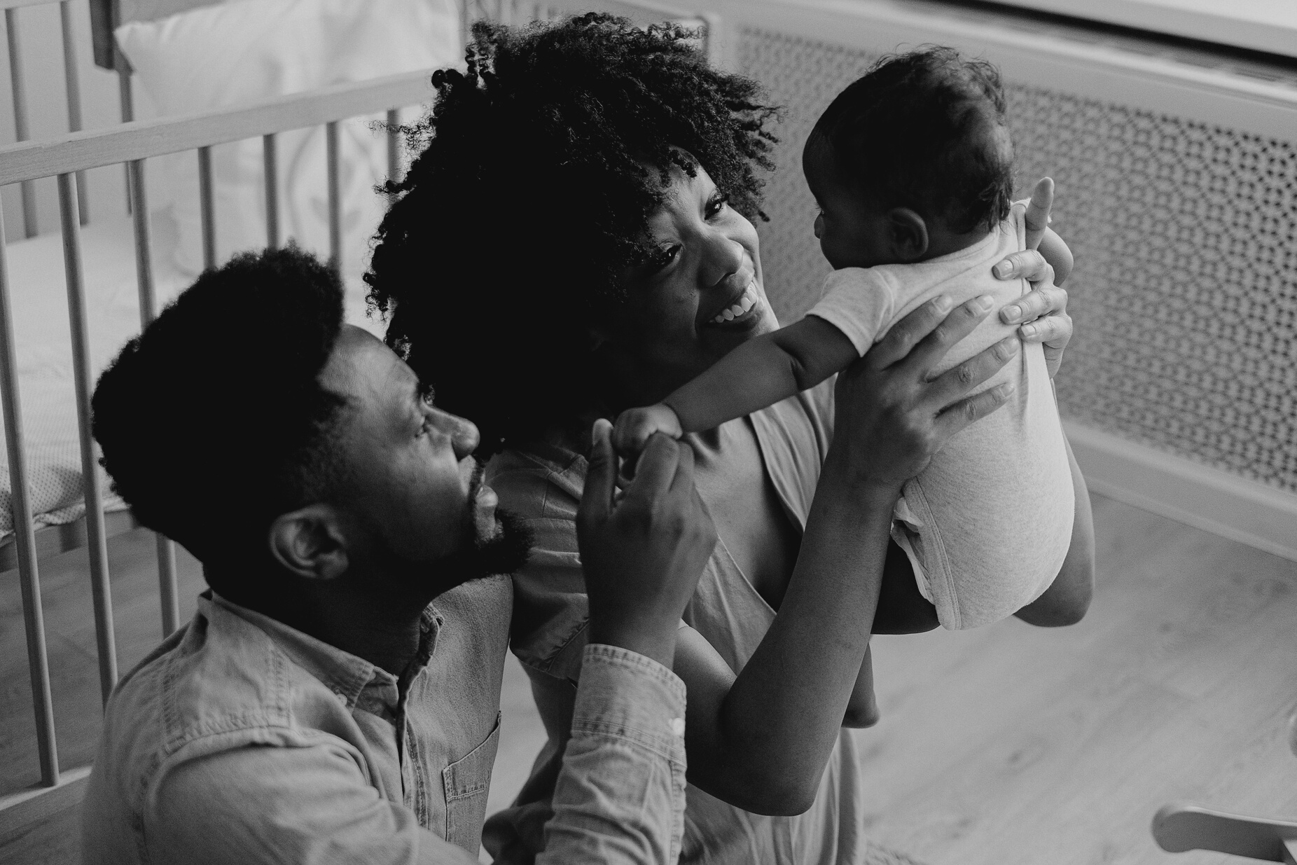 Parents Carrying a Baby